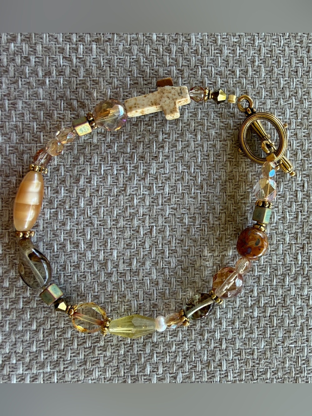 Gold-Tone Beaded Cross Bracelet in Cream and Amber